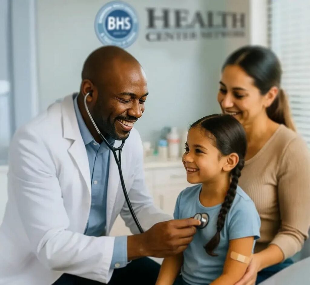A BHS Health Center Network physician examining a young patient alongside her mother